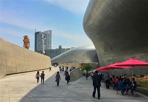 Seouls Futuristic Cityscape People Walk Around The Dongdaemun Design