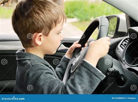 Boy Driving A Car And Looking At The Way Stock Photo Image Of Person