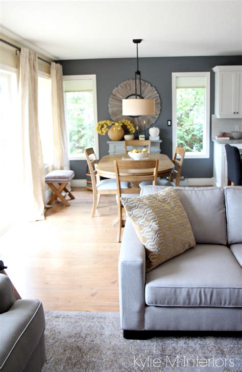 So, swear off the white emulsion, and pick up a bold shade for your living room color instead. Modern country or farmhouse style open concept dining room and living room with gray and warm ...