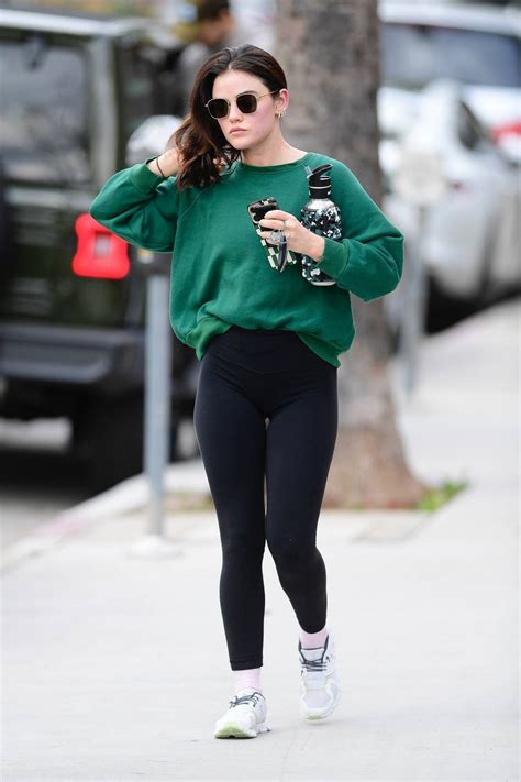 Lucy Hale Sports A Green Sweatshirt And Black Leggings As She Leaves