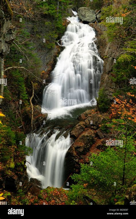 Crystal Cascade Waterfall And Fall Foliage With Water Flow Running