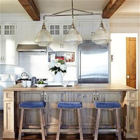 Barrington distressed black and wood tone rustic seeded glass linear kitchen island light. Ivory Kitchen Island with Blue Nailhead Counter Stools ...