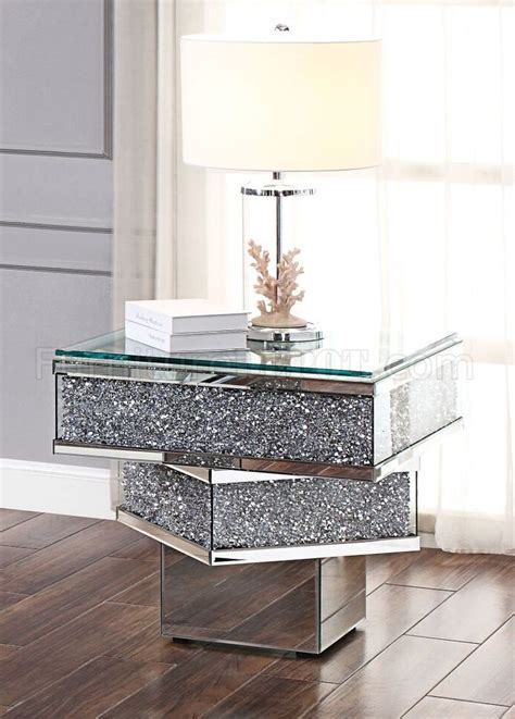 The impressive design elements mix contemporary and industrial themes into one impressive transitional look. Noralie Coffee Table 81465 in Mirror by Acme w/Options
