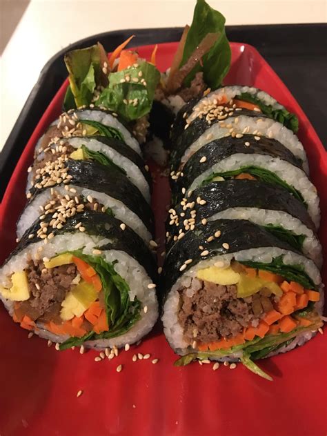 Kimbap is korean seaweed rice roll that is made with seasoned rice and various veggies and meat that's rolled in dried seaweed (kim). I ate Bulgogi kimbap (seaweed rice roll with beef and ...