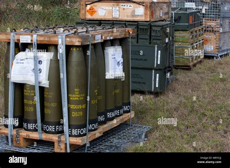 A Pallet Of 155 Mm Artillery Shells And Other Munitions Sit Staged On