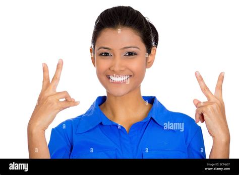 Portrait Of A Young Happy Confident Woman Giving Peace Victory Or Two