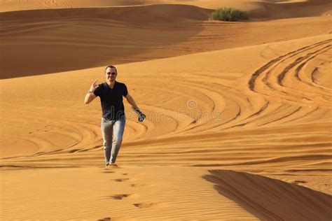 Man Walking Alone In The Sunny Desert Stock Photo Image Of Person