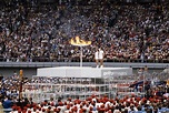 View of Stephane Prefontaine and Sandra Henderson lighting Olympic ...