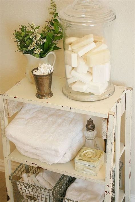 Small bathroom glass shelves are the perfect place to store functional yet decorative items such as perfumes. Picture Of white shabby bathroom shelf