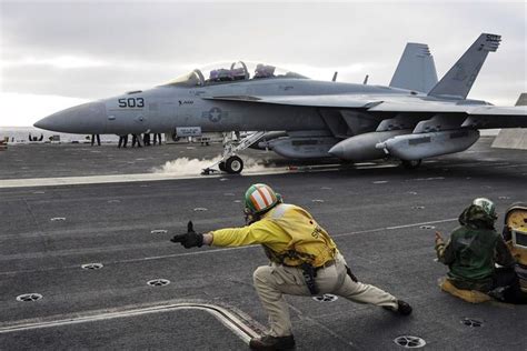 N Ea 18g Growler Launches Off The Flight Deck Of The Aircraft Carrier