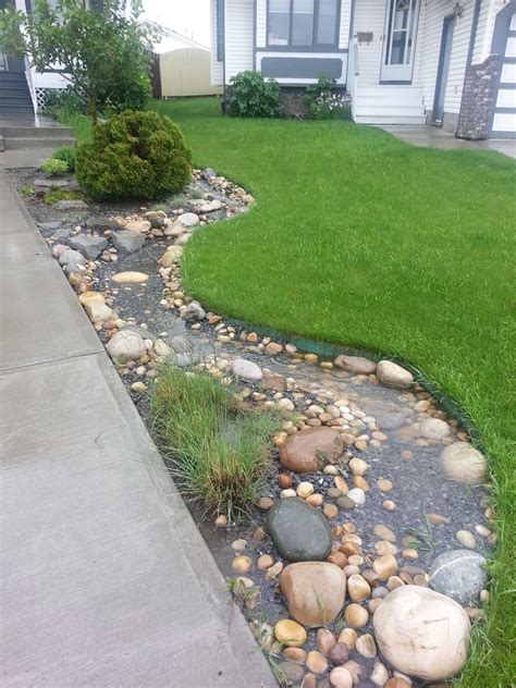 Dry Stream Bed Functions In Spring Rain Rain Garden Design Rock