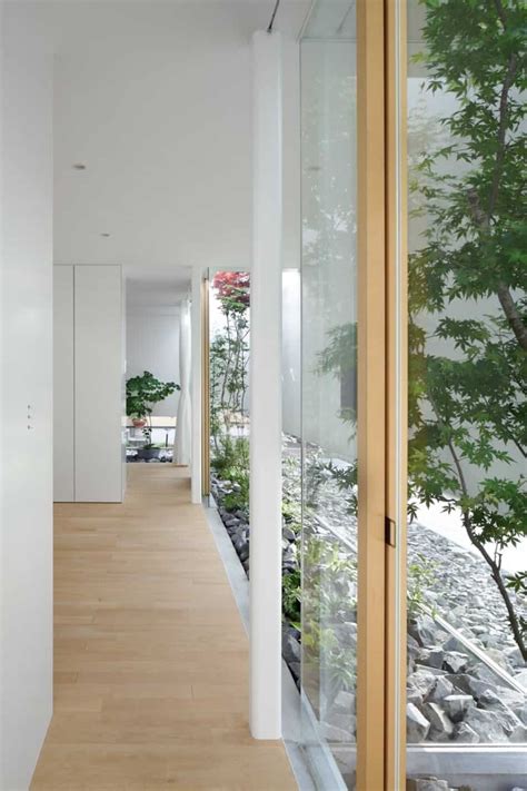 House With Floating Facade Glass Walls And Interior Courtyard