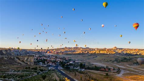 Hot Air Balloon Flying Over Rock Landscape At Cappadocia Turkey Stock