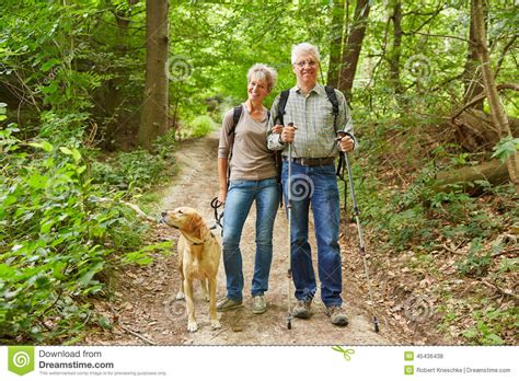 Senior Couple Walking In Forest Stock Photo Image Of