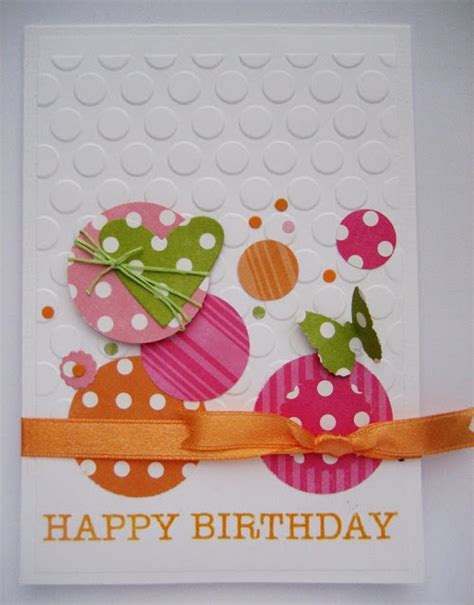 A Happy Birthday Card With Polka Dots And Orange Ribbon On The Bottom Decorated With Paper Circles