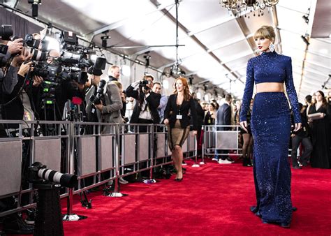 grammys 2023 taylor swift in roberto cavalli in or out tom lorenzo