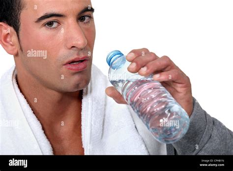 Man Drinking From Bottle Of Water Stock Photo Alamy
