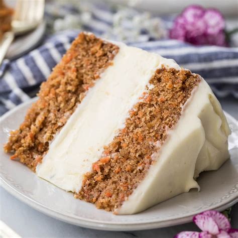A Slice Of Carrot Cake On A White Plate