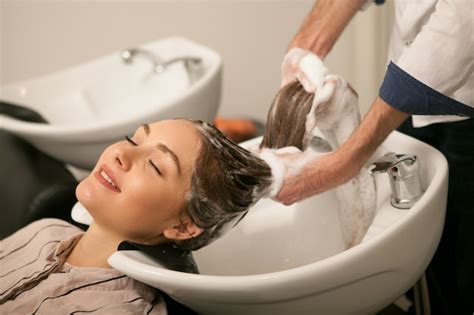 Premium Photo Gorgeous Woman Having Her Hair Washed By Hairdresser