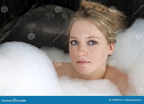 Serious Woman Enjoys The Bath Foam In The Bathtub Stock Photo Image