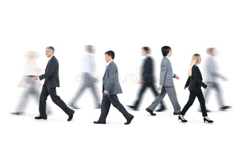 Group Of Business People Walking In Different Directions Stock Photo