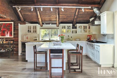 Log cabin with white kitchen cabinets. Transitional White Kitchen with Black Walnut Barstools ...