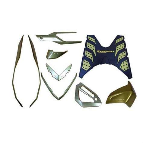 Ada banyak aksesoris honda vario 150 yang bisa kita beli, salah satunya yaitu garnish cover muffler. Paket Aksesoris Honda Vario 125 & 150 eSP Gold 7 Item (08000K59GLD)