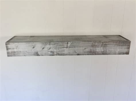 Rustic floating shelves with a rough cut + hatch grey finish. Floating Shelves • Insteading