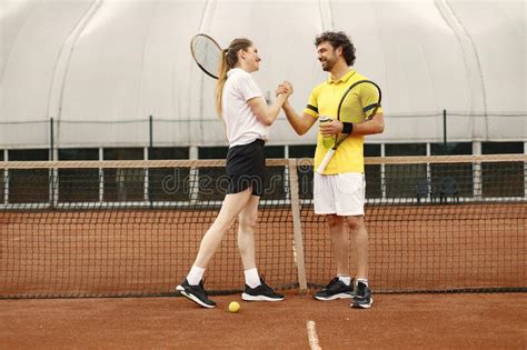 Two Tennis Players Shaking Hands At Tennis Court Before The Match Stock Image Image Of Fitness
