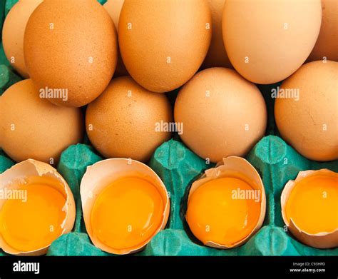Stacked Brown Eggs With 4 Broken Stock Photo Alamy
