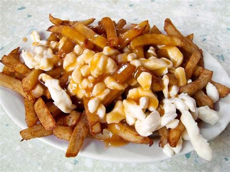 Poutine Canadian Comfort Food French Fries And Cheese Curds Britannica