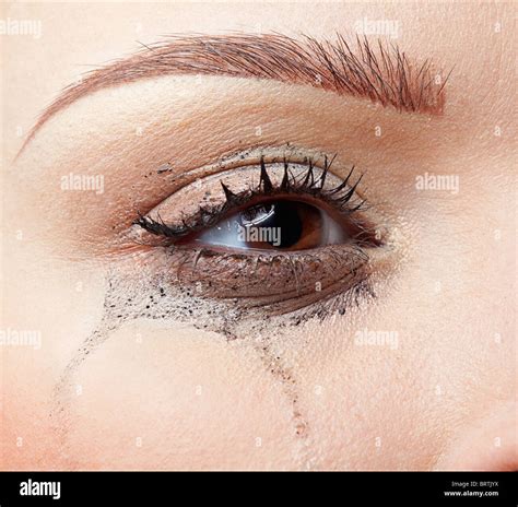 Close Up Portrait Of Beautiful Crying Girl With Smeared Mascara Stock