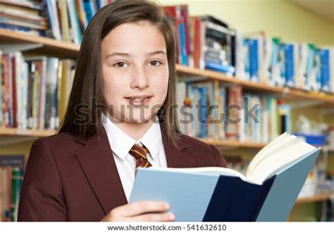 Girl Wearing School Uniform Reading Book Stock Photo 541632610