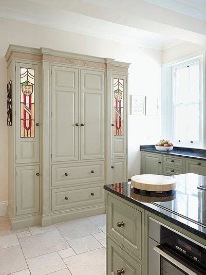 Stained glass and iron fixture hangs over the centre island to shine a soft light over the canadian peribonka granite top. Farrow & Ball Green Ground | Farrow and ball kitchen ...