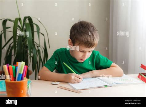 Boy Doing Homework Table Hi Res Stock Photography And Images Alamy
