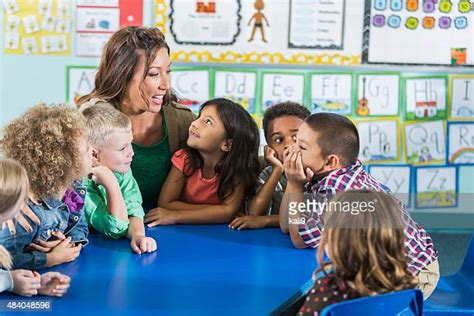 Preschooler And Teacher Talking Photos And Premium High Res Pictures