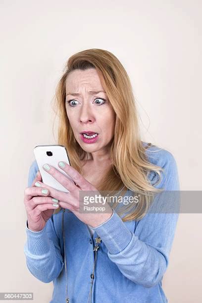 Woman Phone Shocked White Background Photos And Premium High Res