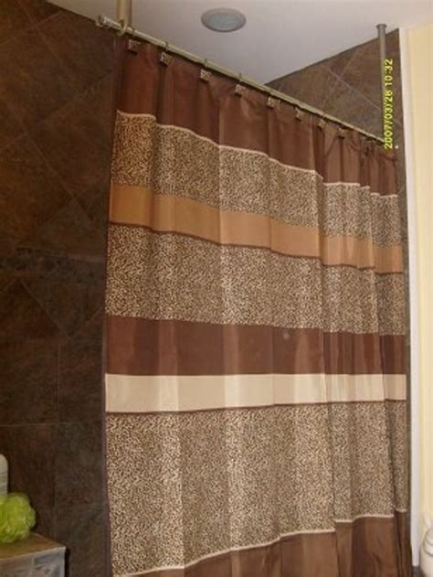 The space is small, and one of the walls that the shower curtain rod would mount to has a piece of window trim. How to build a ceiling mounted shower curtain hanger rod ...