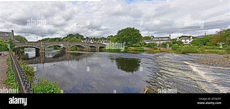 Old Stone Bridge With Flowing River Cree And Weir In Newton Stewart