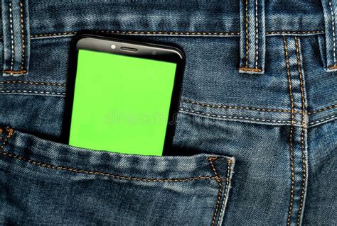 Smartphone With A Green Screen In The Back Pocket Of Jeans Pants Phone