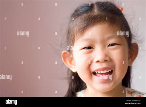 Little Asian Girl With Smile On Her Face Stock Photo Alamy