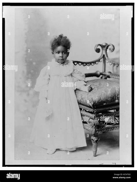 african american girl full length portrait standing next to chair facing front lccn99472201