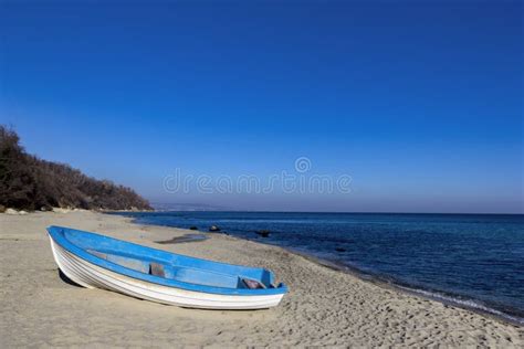 Lonely Boat On The Beach Stock Photo Image Of Seascapes 82862852