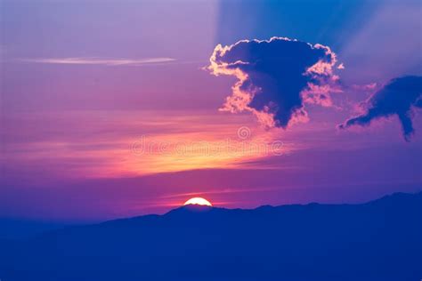 Beautiful Colorful Sunset With Dramatic Clouds And Sun Shining Stock