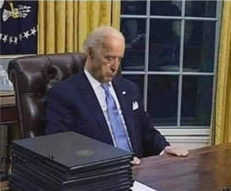 Photograph Showing Joe Biden Sleeping At His Desk Was