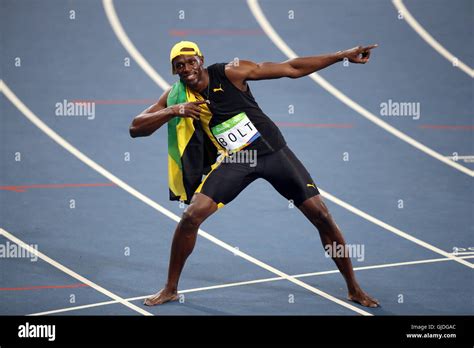 jamaica s usain bolt celebrates winning the men s 100m final at the olympics stadium on the