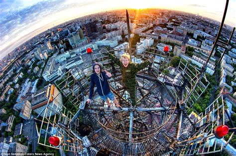 Pictures Show Russian Daredevils Dangling Off The Citys Tallest