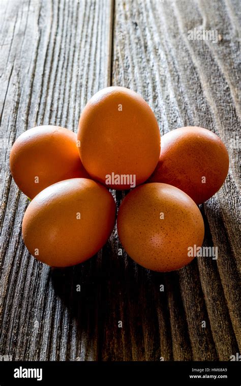 A Half Dozen Eggs On A Rustic Wooden Table Stock Photo Alamy