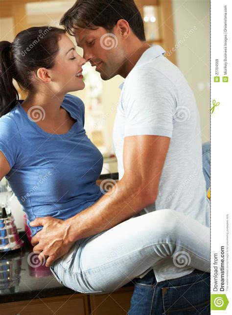 Romantic Couple Hugging In Kitchen Royalty Free Stock