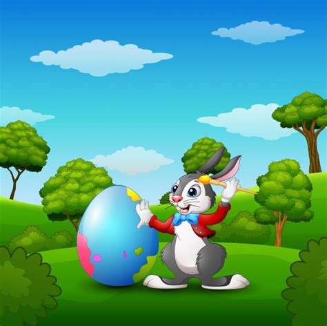 Premium Vector Cartoon Easter Bunny Painting Easter Eggs In The Woods
